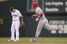 SEATTLE - AUGUST 30:  Mike Trout #27 of the Los Angeles Angels of Anaheim rounds the bases past shortstop Brendan Ryan #26 of the Seattle Mariners after hitting a solo home run in the second inning at Safeco Field on August 30, 2025 in Seattle, Washington. (Photo by Otto Greule Jr/Getty Images)