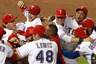 ARLINGTON, TX:  (L-R) Ian Kinsler #5, Craig Gentry #23, Michael Young #10 and Adrian Beltre #29 of the Texas Rangers celebrate winning Game Six of the American League Championship Series 15-5 against the Detroit Tigers to advance to the World Series at Rangers Ballpark in Arlington in Arlington, Texas.  (Photo by Ronald Martinez/Getty Images)