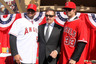 ANAHEIM, CA:  Angels owner Arturo Moreno stands between Albert Pujols #5 and C.J. Wilson #33 at a public press conference introducing them as newly signed Los Angeles Angels of Anaheim  players at Angel Stadium in Anaheim, California.  (Photo by Stephen Dunn/Getty Images)