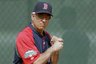 Boston Red Sox manager Bobby Valentine eyes a pitch while taking a batting stance during a workout as pitchers and catchers officially report to baseball spring training on Sunday in Fort Myers, Fla. (AP Photo/David Goldman)