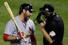 ARLINGTON, TX: Lance Berkman #12 of the St. Louis Cardinals argues with home plate umpire Ron Kulpa after being called out on strikes in the seventh inning during Game Four of the MLB World Series against the Texas Rangers at Rangers Ballpark in Arlington in Arlington, Texas.  (Photo by Rob Carr/Getty Images)