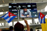 MIAMI, FL - Protesters rally outside as Miami Marlins Manager Ozzie Guillen seen on a screen speaks during a press conference about comments made about Fidel Castro at Marlins Park. The Marlins suspended Guillen for five games over his pro-Castro comments.  (Photo by Mike Ehrmann/Getty Images)