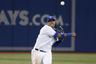 Toronto, ON, CANADA; Toronto Blue Jays shortstop Yunel Escobar (5) throws to first base during the ninth inning against the Tampa Bay Rays at the Rogers Centre. Tampa Bay defeated Toronto 12-2. Mandatory Credit: John E. Sokolowski-US PRESSWIRE