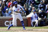 Apr 12, 2012; Chicago, IL, USA; Chicago Cubs left fielder Alfonso Soriano (12) breaks his bat as he singles and drives in two runs in the third inning against the Milwaukee Brewers at Wrigley Field.  Mandatory Credit: David Banks-US PRESSWIRE