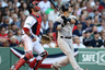Nick Swisher of the New York Yankees hits a grand slam as Jarrod Saltalamacchia of the Boston Red Sox defends at Fenway Park in Boston, Massachusetts.  (Photo by Elsa/Getty Images)