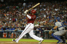 Justin Upton #10 of the Arizona Diamondbacks hits a RBI triple against the Los Angeles Dodgers during the first inning of the MLB game at Chase Field in Phoenix, Arizona.  (Photo by Christian Petersen/Getty Images)