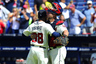 Atlanta, GA, USA; Atlanta Braves catcher Brian McCann (16) and relief pitcher Anthony Varvaro (38) hug after the final out against the New York Mets during the ninth inning at Turner Field. The Braves defeated the Mets 6-1. Mandatory Credit: Dale Zanine-US PRESSWIRE