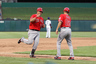 Arlington, TX, USA; Los Angeles Angels designated hitter Kendrys Morales (8) celebrates his sixth inning grand slam with third base coach Dino Ebel (21) against the Texas Rangers at Rangers Ballpark.  Mandatory Credit: Matthew Emmons-US PRESSWIRE