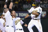 Jonny Gomes, Coco Crisp and Josh Reddick of the Oakland Athletics celebrate a walk off victory in the bottom of the 15th inning defeating the Toronto Blue Jays 5-4 at O.co Coliseum in Oakland, California. Crisp hit a sacrifice fly scoring Jemile Weeks from third base. (Photo by Thearon W. Henderson/Getty Images) 