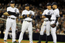 Mark Teixeira, Robinson Cano, Alex Rodriguez and Derek Jeter of the New York Yankees look on during a pitching change against the Texas Rangers in Game Three of the ALCS at Yankee Stadium in New York, New York.  (Photo by Al Bello/Getty Images)