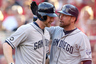 Chase Headley of the San Diego Padres is congratulated by Mark Kotsay after hitting a home run against the Cincinnati Reds at Great American Ball Park in Cincinnati, Ohio.  (Photo by Andy Lyons/Getty Images)