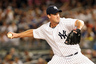 Aug 13, 2012; Bronx, NY, USA;  New York Yankees relief pitcher Derek Lowe (34) pitches during the sixth inning against the Texas Rangers at Yankee Stadium.  Mandatory Credit: Anthony Gruppuso-US PRESSWIRE