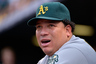 Starting pitcher Bartolo Colon of the Oakland Athletics looks on from the dugout as he earned the win against the Colorado Rockies in an 8-5 win during Interleague Play at Coors Field.  (Photo by Doug Pensinger/Getty Images)