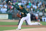A.J. Griffin of the Oakland Athletics pitches against the Boston Red Sox during a Major League Baseball game at the O.co Coliseum in Oakland, California. (Photo by Jed Jacobsohn/Getty Images)