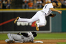 DETROIT, MI -  Omar Infante of the Detroit Tigers can't make a throw to first base and avoid the slide by Orlando Hudson of the Chicago White Sox at Comerica Park   (Photo by Gregory Shamus/Getty Images)