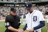 Home plate umpire Jim Joyce, left, shakes hands with Detroit Tigers pitcher Armando Galarraga while handing the lineup card on the field before the Detroit Tigers-Cleveland Indians MLB baseball game in Detroit, Thursday, June 3, 2010. Galarraga lost his bid for a perfect game with two outs in the ninth inning on a disputed call at first base by Joyce on Wednesday night. (AP Photo/Paul Sancya)